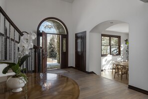 Welcome inside from your aspen tree lined driveway up.  Grand foyer greeting.