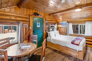 Front room of cabin. Dining Area, Cabin Entrance, Queen Bed