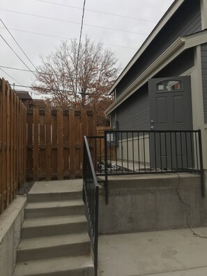 Steps leading from main house to the private entrance of the unit.