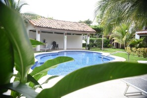 Soak up the sun or enjoy the shaded rancho area at the community pool.
