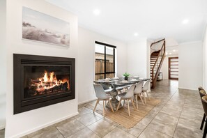 Dining area with gas fireplace. 