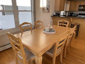 The dining table sits six, and the counter sits two people. 