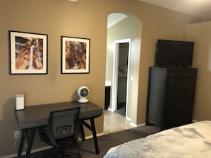 Master bedroom, TV, desk and dresser. 
