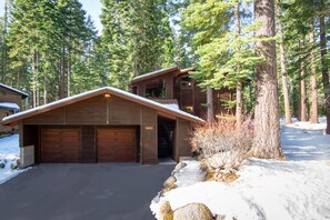 Driveway + covered entry stairs to front door (1 garage spot + 2 driveway spots)