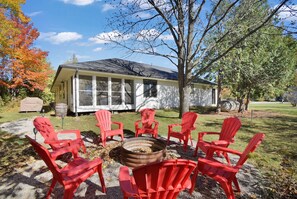 Firepit off the sunroom and grill