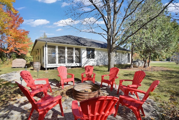 Firepit off the sunroom and grill