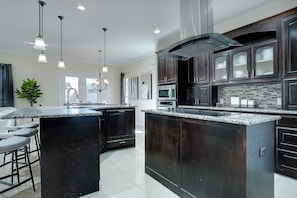 Massive chef's kitchen with 2 stainless steel refrigerators