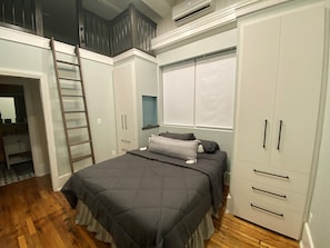 Master bathroom with stairs to loft air mattress sleeping area.