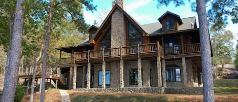 A large three story log home on Smith Lake overlooking the National Forest.