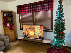 Cozy living room with festive decor. Perfect for your holiday getaway!