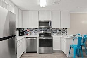 Gorgeous updated kitchen with breakfast bar (seats 3), stainless steel appliances, and fully-stocked for guest stay