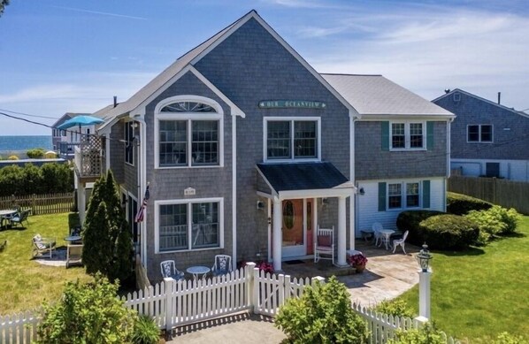 Front of house. Private lot for 3 cars, fenced in yard and landscaping. 