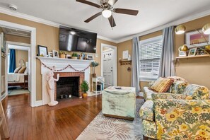 It could be Grandma's sofa or it could be Anthropology. This living room space is intended for relaxing and working. Please only candles in the fireplace.
