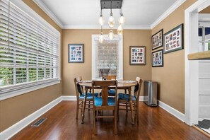 Enjoy a meal or snack in the dining room. You might see a fender bender out the dining room window or you might enjoy seeing some old family photos.
