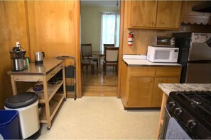 coffee maker, tea kettle, microwave, toaster oven, refrigerator, step stool.