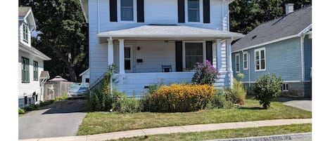 Front view.  Driveway is to the left of the house.