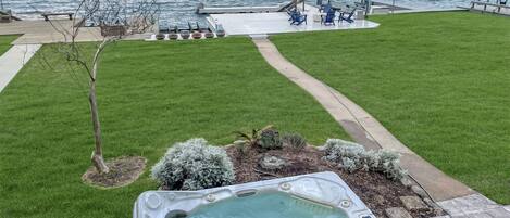 Our waterfront backyard = oasis; grass, dock, patio, hot tub & boat/jet ski lift