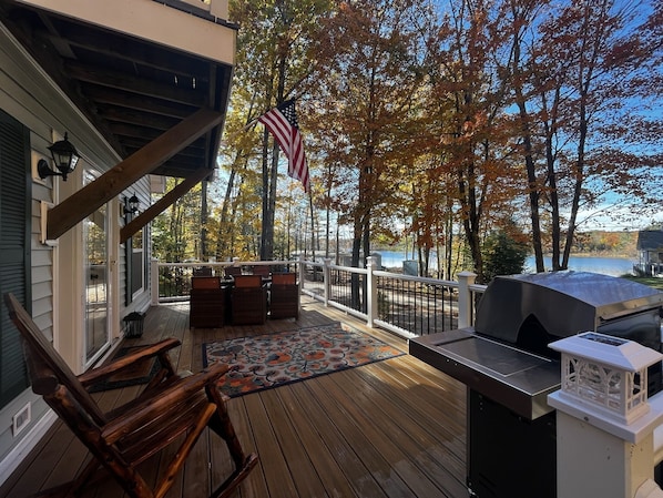 Furnished, composite deck that spans the front of the home on the main level