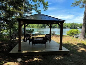 Our private waterfront with gazebo, chairs and dock