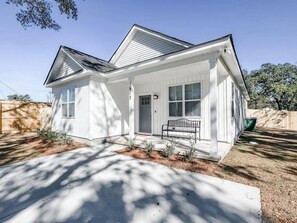 Front patio with bench. Access to the entire driveway, big enough for 4 vehicles.

Free street parking is available as well.