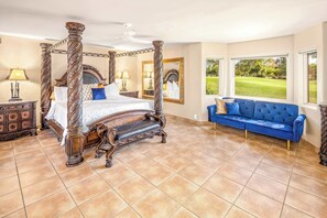 View from an ensuite bedroom with massive picture windows with UV-coated privacy overooking golf green and French glass doors opening to an interior courtyard with a heated enclosed swimming pool