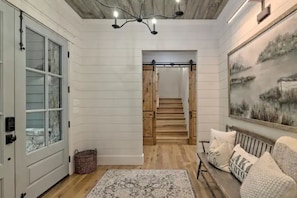 Stairs just beyond foyer lead to a private bedroom & ensuite bath (above garage)