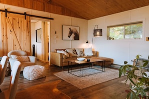 High ceilings, with a balanced blend of modern furnishings and rustic charm