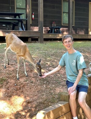 One of our guests with a new friend on our back patio 07/11/2025