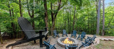 Rear view of the patio w/ firepit Giant Adirondack Chair from the rear cabin