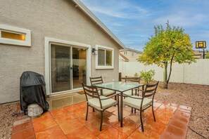 The backyard is fully fenced and private with no neighbors on the backside (or on one side) Very quiet and peaceful. Patio with dining for 4, gas BBQ, fruit trees.