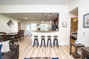 Kitchen island with 4 bar stools and dining area with 4 chairs!