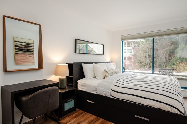 Primary Bedroom - Enjoy pool views from the primary bedroom, offering a king bed and work space