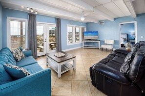 Living Room - Enjoy some cozy family time after a long beach day!