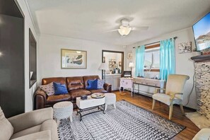Sink into luxury with our comfortable sofa adorned with plush pillows, your ultimate relaxation spot.