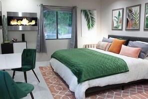 Unwind in a plush king bed with luxurious linens, designed to provide a restful and rejuvenating sleep.