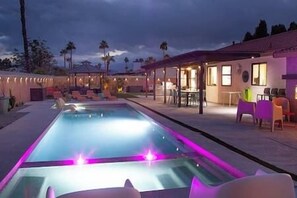 Relax in the sparkling pool or unwind in the hot tub, surrounded by a peaceful backyard oasis.