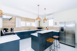 Well-Designed Kitchen of the Apartment in Noord Aruba - Ample storage space for organized and clutter-free counters - Open concept connecting the kitchen to the dining or living area - Thoughtful placement of kitchen essentials for easy access