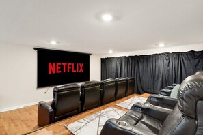 10 reclining movie theater seats in our theater/game room!