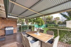  Dine alfresco on the spacious undercover deck, where you’ll find a BBQ and a six-seater table seating overlooking the backyard. 
