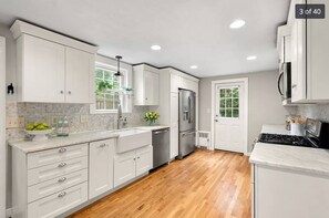 Open Kitchen, the door connects with the deck and the backyard