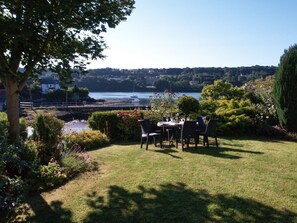 Lawned garden area with outdoor furniture | Neuadd, Menai Bridge, near Bangor