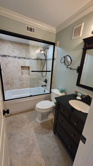Primary bedroom has a private bath with tub and shower