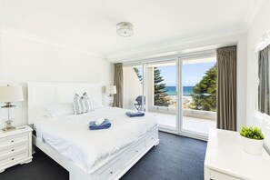 Main bedroom with king bed and ocean view