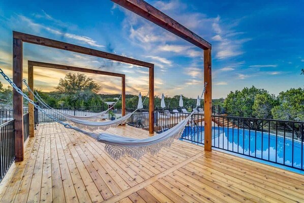 Relax and unwind in the hammocks by the pool.