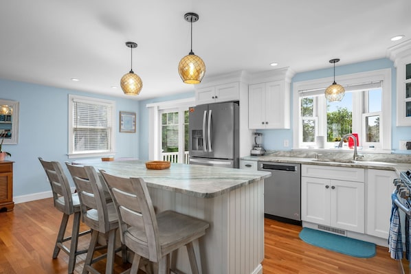 Fully applianced kitchen with breakfast bar with seating for 3