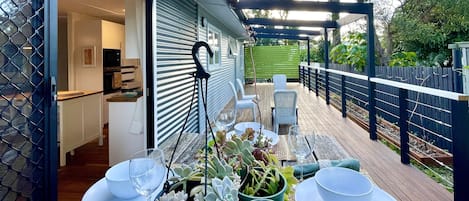 Enjoy eating at the tree stump table on the back deck under the banana fronds. 