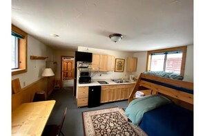 Kitchen w/ fridge, stove, micro, toaster oven.  Twin over double bunk bed. 