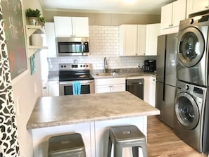 washer and dryer located in kitchen area