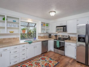 Large open space kitchen with stainless steal appliances