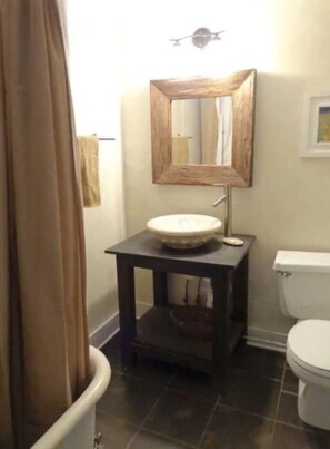 Upstairs bathroom; claw-foot tub.